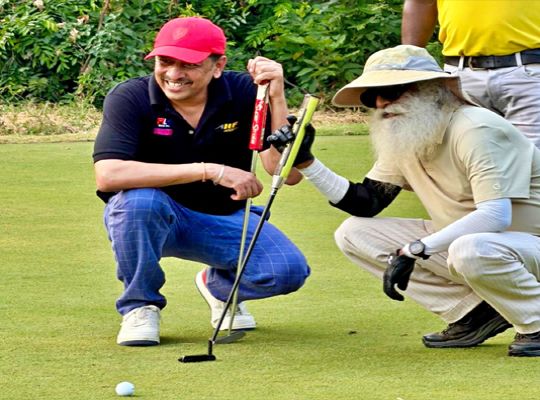 'Spiritual energy' descends on Patna's golf course: Sadhguru wields the golf club and hits impressive shots.