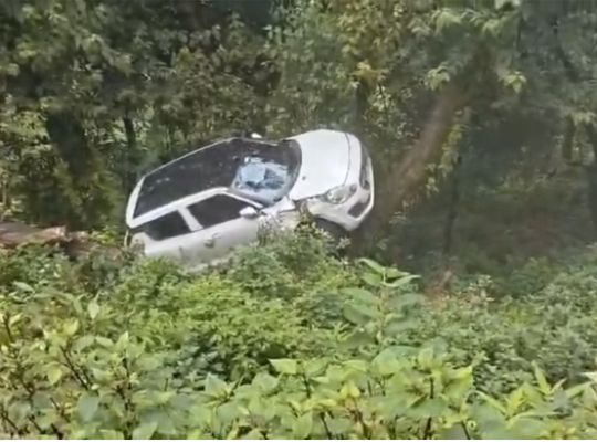  Uttarakhand: Delhi-registered car goes out of control due to slippery conditions on the Dudhli road in Mussoorie; a tree halts its fall into the gorge, saving the lives of two youths.